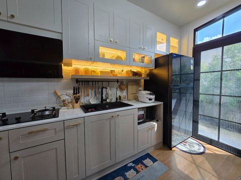 Towmhome with side garden, builtin furniture and electrical appliance at saimai province