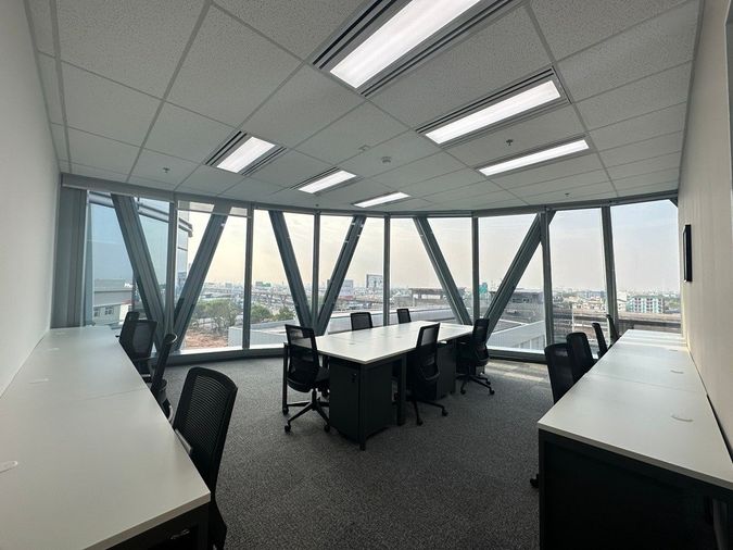 Office space for rent with full-service amenities, located inBang Phli  The building features an on-site coffee shop  lobby area for welcoming guests.