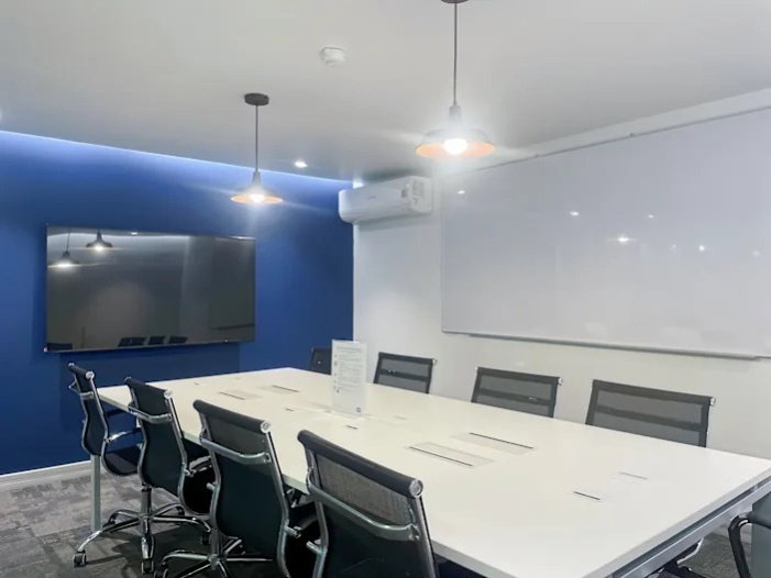 Office for rent with modern coworking space, Blue Chips Thonglor Building. Inside is a modern lobby that opens up to a contemporary office space.