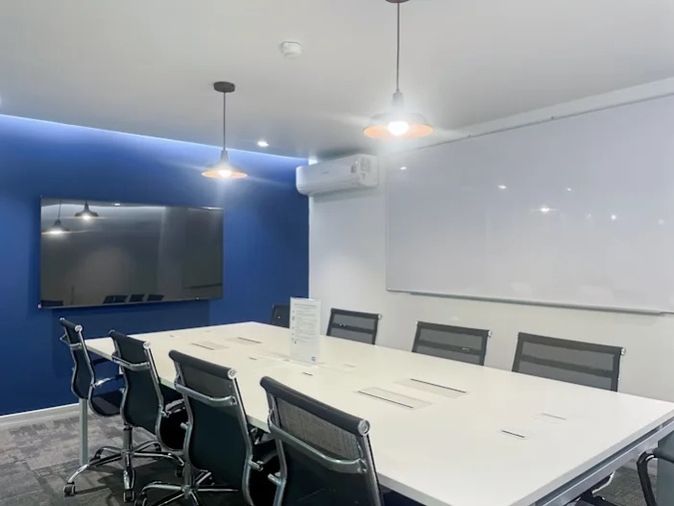 Office for rent with modern coworking space, Blue Chips Thonglor Building. Inside is a modern lobby that opens up to a contemporary office space.