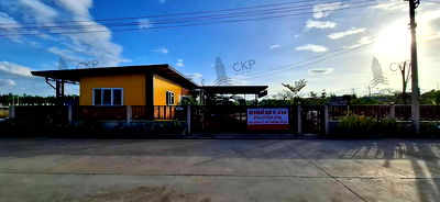 Land for sale : House and land, Baan Suan Mai Ngam Project, Khlong 15, with mixed garden, sprinkler system, have water and electricity.