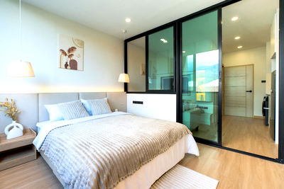 Condos for sale 700 Year Sports Arena Chiang Mai : Rimnam Mansion Condo Modern minimalist style condo with  Doi Suthep views.  next to CMU Tel: 098-9690236(Janny)