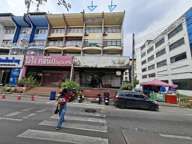Four-story commercial building, Happyland.