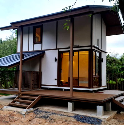 Houses for sale : Prefabricated modular homes for sale. Loft style, balcony, and includes a pet house. Construction services available nationwide.