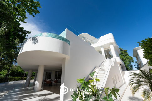 Luxury 3-story modern pool villa for sale near Pattaya with views of Khao Chee Chan.
