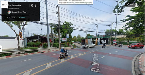 Land for sale, large plot consisting of 2 title deeds, located on the main road, Pracha Uthit Road, adjacent to Soi Pracha Uthit 84/3.